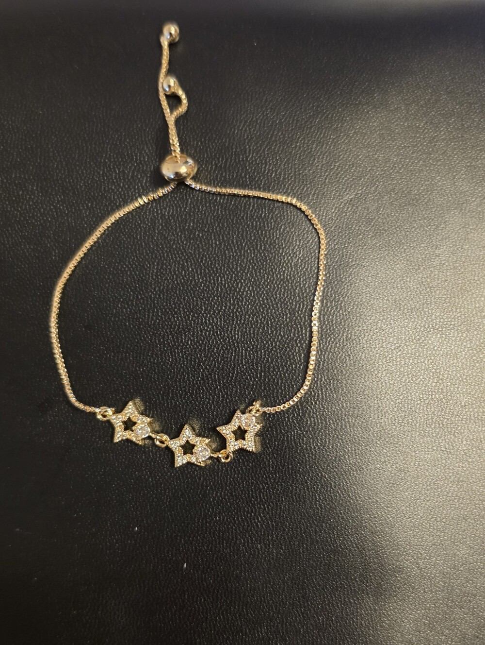 Delicate Gold Tone Star Bracelet with Sparkling Cubic Zirconia
